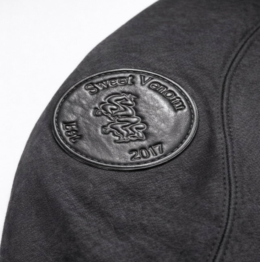 Black jacket with 'Sweet Venom' logo on the sleeve